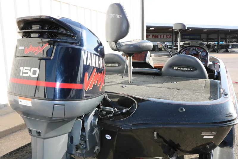 Slide: The Image of 2004 Ranger 185 VS boat with Yamaha VMAX 150 outboard motor, featuring spacious deck and seating. - 10