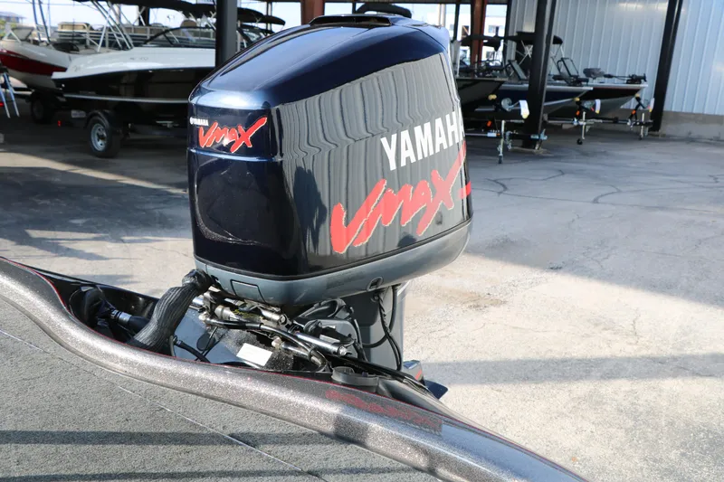 Slide: The Image of 2004 Ranger 185 VS boat with Yamaha VMAX outboard motor in a marina setting. - 16
