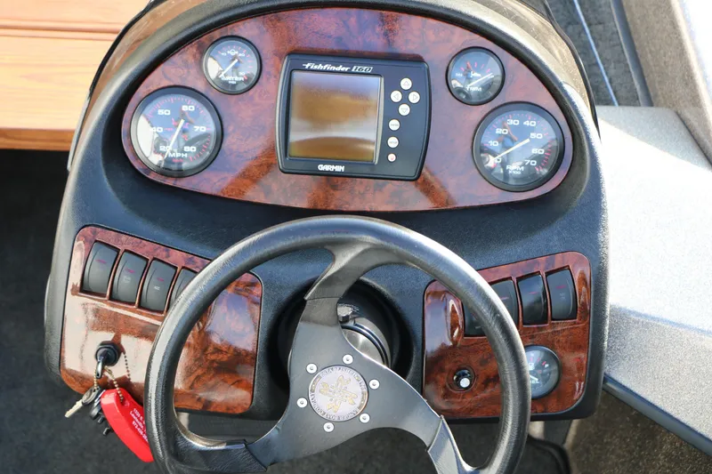 Slide: The Image of Dashboard of 2004 Ranger 185 VS boat with gauges and Garmin fishfinder. - 33