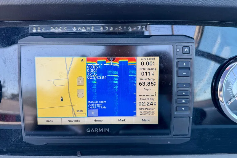 Slide: The Image of Garmin GPS display on 2023 Crownline Eclipse E235 XS boat dashboard. - 14