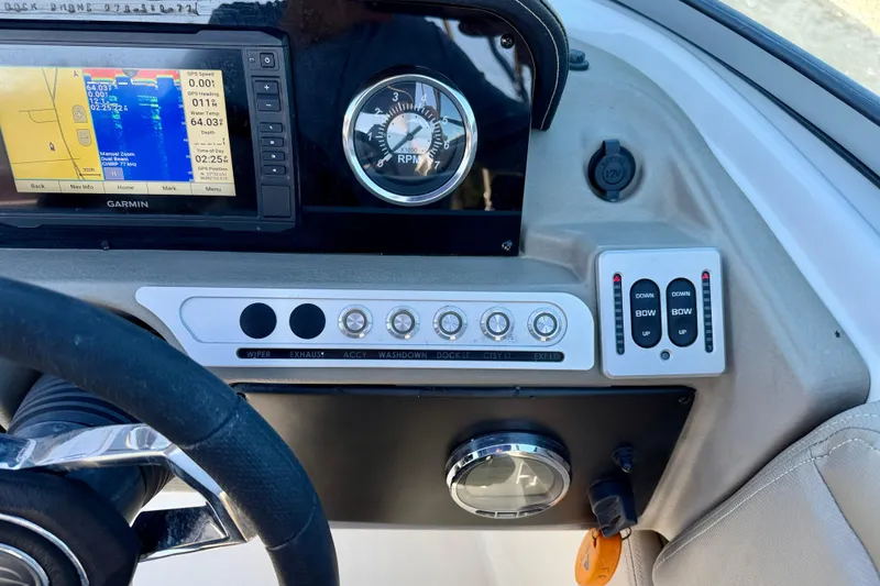 Slide: The Image of Dashboard of 2023 Crownline Eclipse E235 XS with Garmin GPS and control panel. - 16