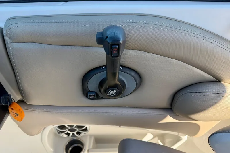 Slide: The Image of 2023 Crownline Eclipse E235 XS boat throttle control on beige interior panel. - 20