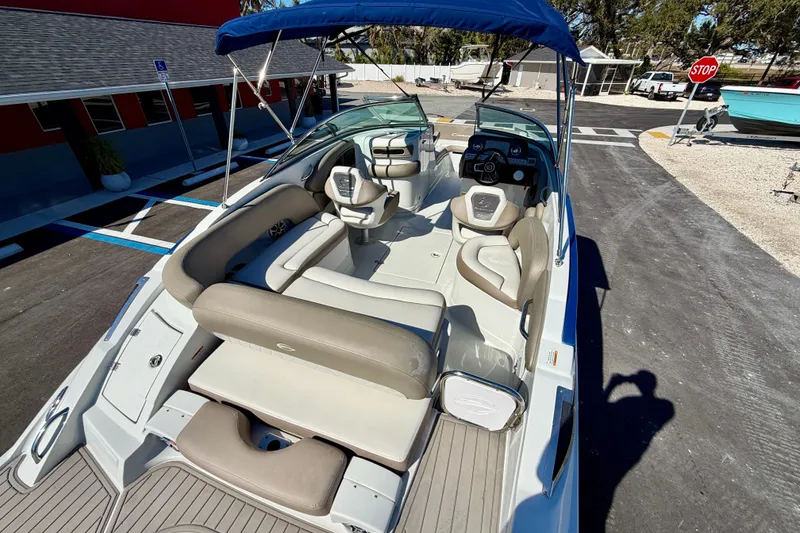 Slide: The Image of 2023 Crownline Eclipse E235 XS boat with spacious seating and modern design. - 27
