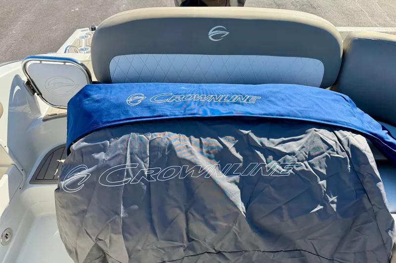 Slide: The Image of 2023 Crownline Eclipse E235 XS boat interior with branded covers. - 35