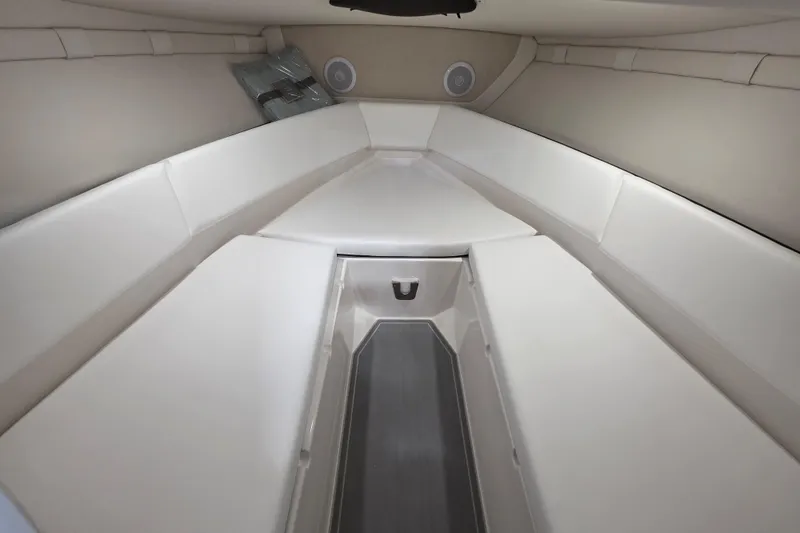 Slide: The Image of 2026 Regal LS4C boat interior with white cushioned seating and modern design. - 13