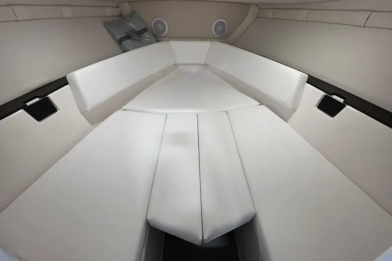 Slide: The Image of 2026 Regal LS4C boat interior with white cushioned seating and modern design. - 15