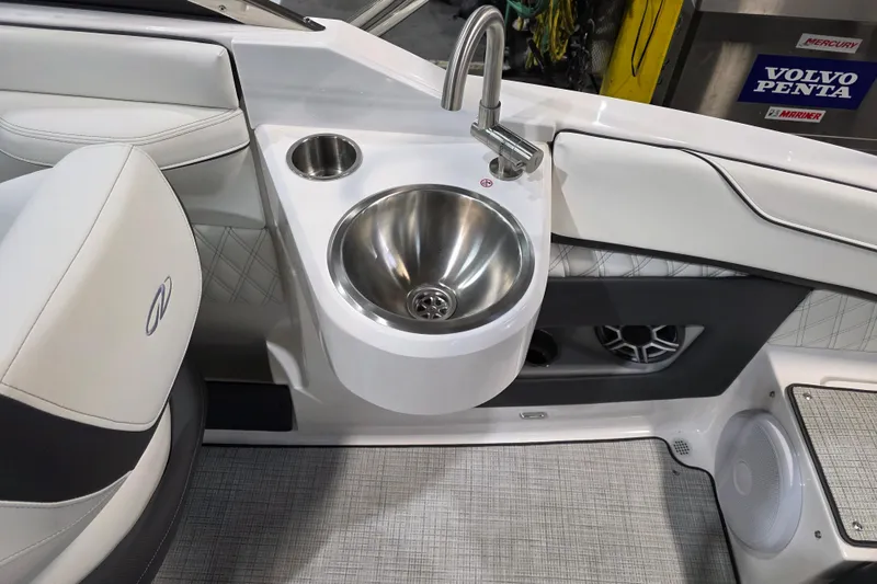 Slide: The Image of 2026 Regal LS4C boat interior with stainless steel sink and modern seating. - 9