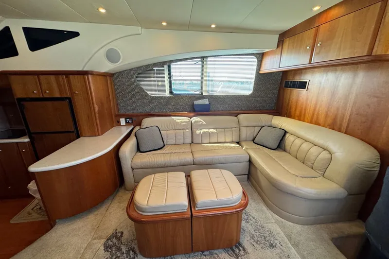 Slide: The Image of Luxurious interior of 2002 Silverton 39 Motor Yacht with plush seating and elegant wood finishes. - 24