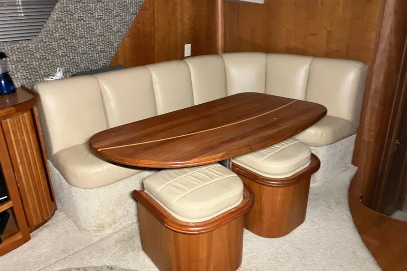 Slide: The Image of Luxurious interior of 2002 Silverton 39 Motor Yacht with elegant wood and leather seating. - 26