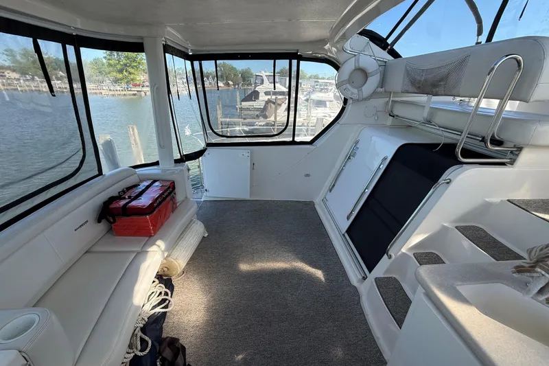 Slide: The Image of Interior of a 2002 Silverton 39 Motor Yacht with seating and water view. - 3