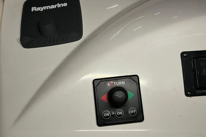 Slide: The Image of Control panel of a 2002 Silverton 39 Motor Yacht with Raymarine and Exturn thruster. - 11