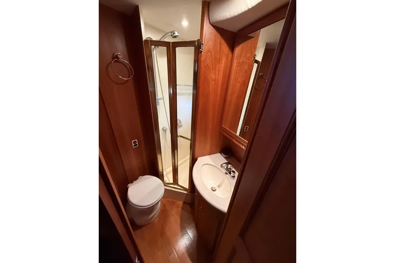 Slide: The Image of Bathroom interior of 2002 Silverton 39 Motor Yacht with shower, sink, and toilet. - 37