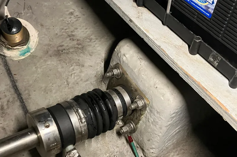 Slide: The Image of Engine compartment of 2002 Silverton 39 Motor Yacht showing shaft and battery. - 54