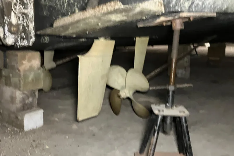 Slide: The Image of 2002 Silverton 39 Motor Yacht propeller and rudder in dry dock. - 60