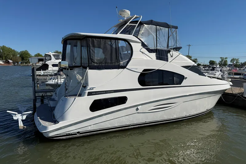 Slide: The Image of 2002 Silverton 39 Motor Yacht docked on a sunny day. - 66