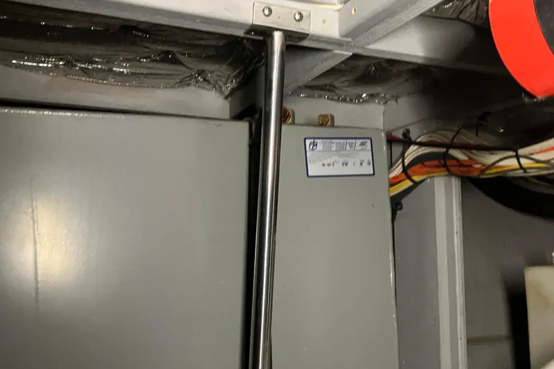 Slide: The Image of Engine room of 2002 Silverton 39 Motor Yacht with electrical panel and wiring. - 45