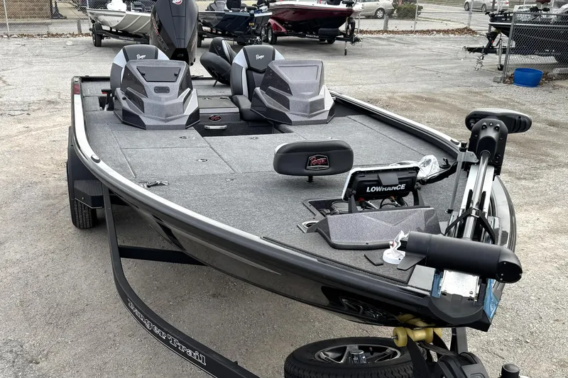Slide: The Image of 2025 Ranger ALPHA 208 fishing boat with advanced navigation equipment, parked outdoors. - 10