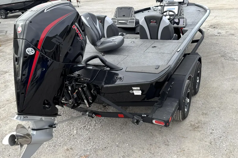 Slide: The Image of 2025 Ranger ALPHA 208 boat with powerful outboard motor and sleek design on trailer. - 13