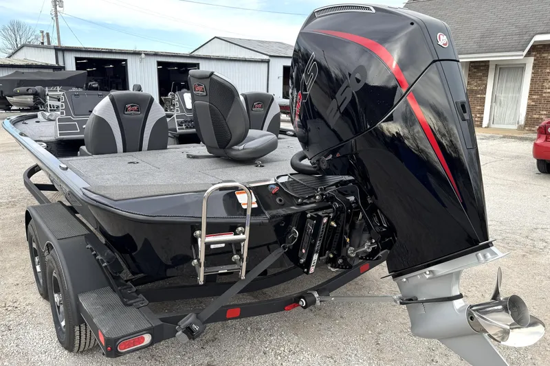 Slide: The Image of 2025 Ranger ALPHA 208 boat with powerful outboard motor, parked on a trailer. - 16