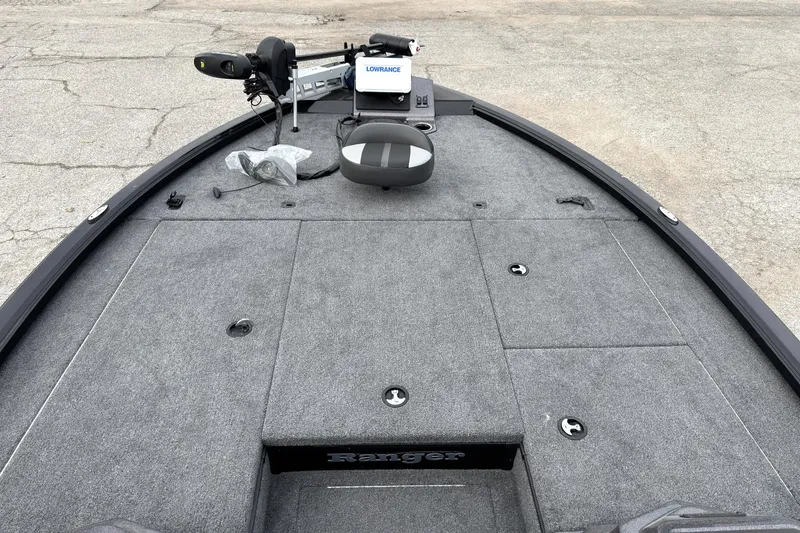 Slide: The Image of Ranger ALPHA 208 boat deck, 2025 model, featuring a Lowrance system and carpeted surface. - 20