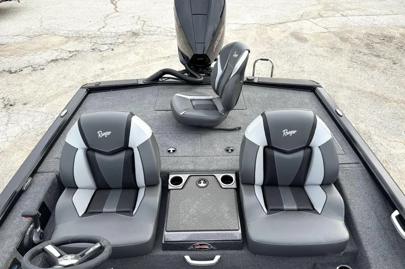 Slide: The Image of 2025 Ranger ALPHA 208 boat interior with sleek gray seating and steering wheel. - 23