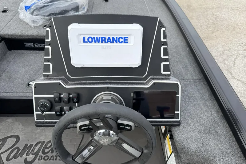 Slide: The Image of Ranger ALPHA 208 boat dashboard with Lowrance Elite display, steering wheel, and controls, 2025 model. - 24