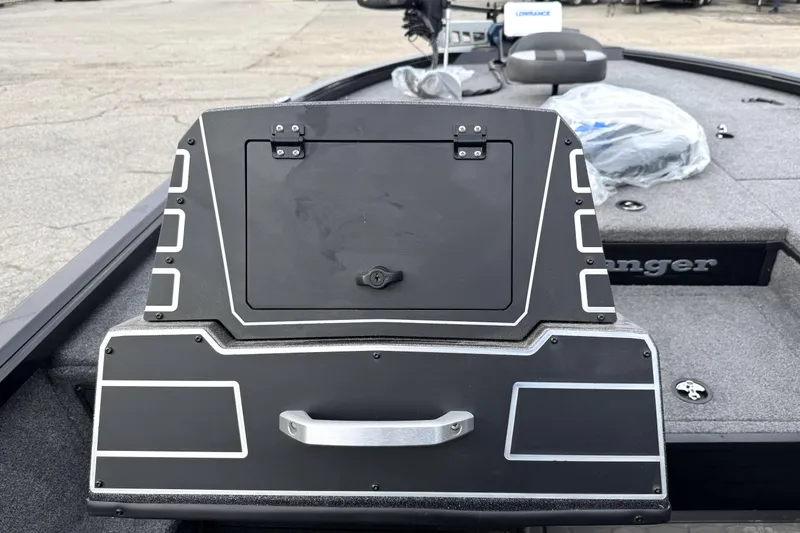 Slide: The Image of 2025 Ranger ALPHA 208 boat console with storage compartment, sleek design, and modern features. - 25