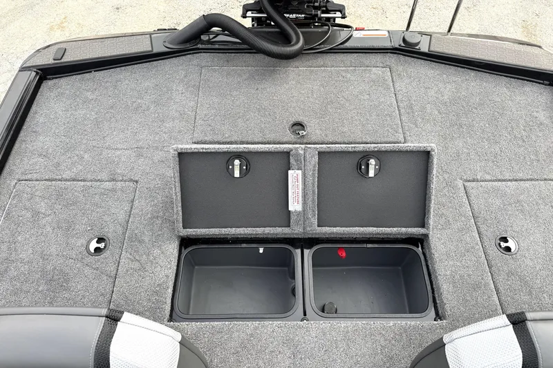 Slide: The Image of 2025 Ranger ALPHA 208 boat deck with storage compartments and gray carpeting. - 27