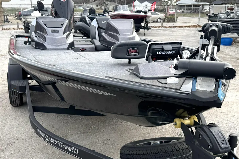 Slide: The Image of 2025 Ranger ALPHA 208 fishing boat with advanced navigation equipment, parked on a trailer. - 9