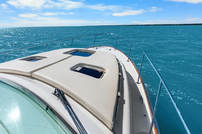 Slide: The Image of 2021 Hinckley Sport Boat 40 X cruising on open blue sea. - 16