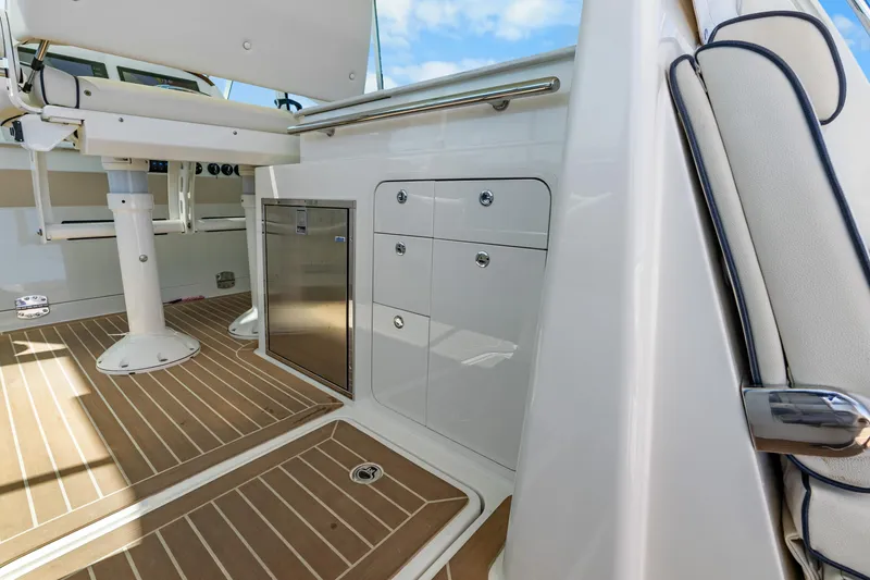 Slide: The Image of 2021 Hinckley Sport Boat 40 X interior with sleek cabinetry and modern design. - 25