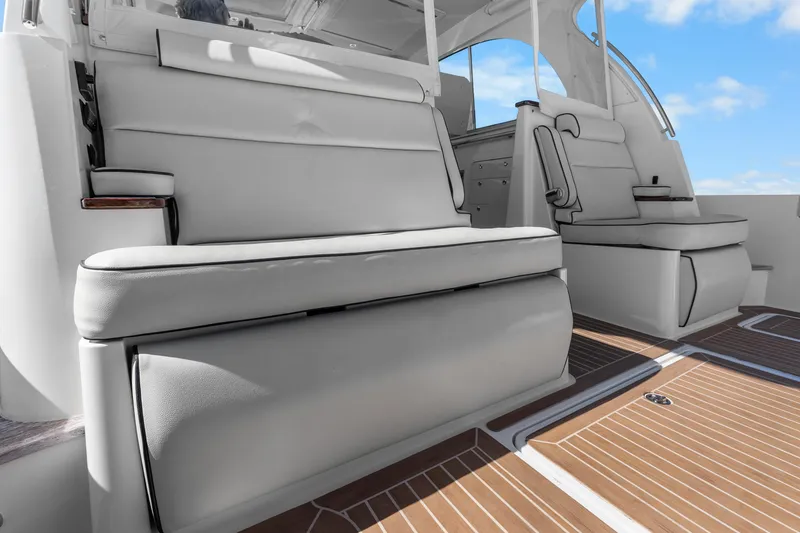 Slide: The Image of 2021 Hinckley Sport Boat 40 X interior with luxurious seating and teak flooring. - 27