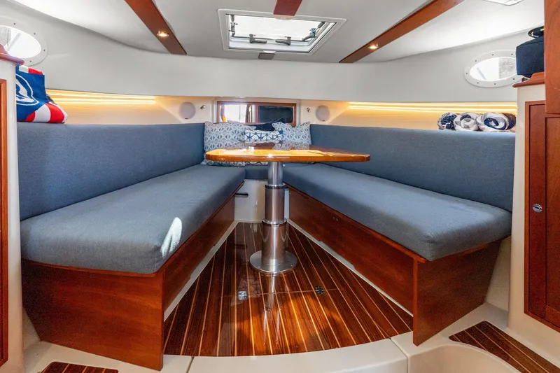 Slide: The Image of Luxurious interior of 2021 Hinckley Sport Boat 40 X with elegant seating and wooden finishes. - 30