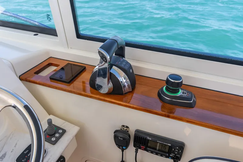 Slide: The Image of Hinckley Sport Boat 40 X 2021 helm with controls and navigation equipment. - 22