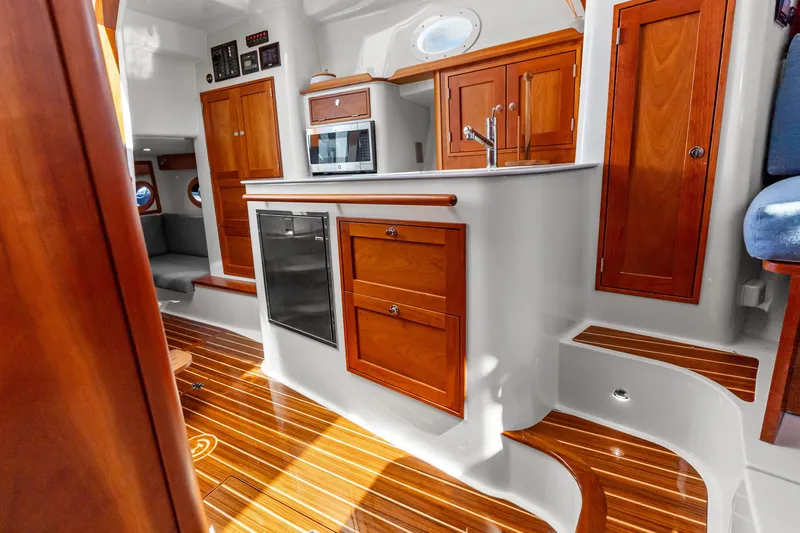 Slide: The Image of Luxurious interior of 2021 Hinckley Sport Boat 40 X with elegant wood finishes. - 31