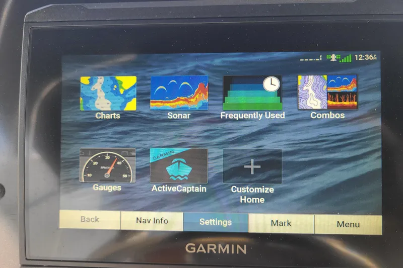 Slide: The Image of Garmin marine display showing charts, sonar, gauges, and customization options on Bulls Bay 2000, 2023 model. - 16