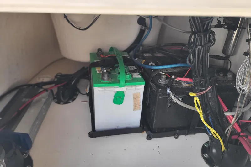 Slide: The Image of Battery compartment of 2023 Bulls Bay 2000 boat with wiring and connections. - 23