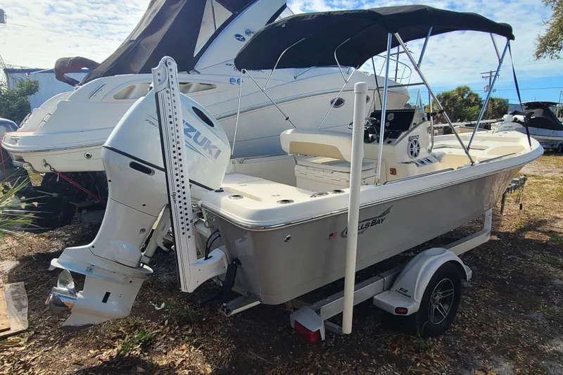 Slide: The Image of 2023 Bulls Bay 2000 boat with Suzuki outboard motor on trailer, parked outdoors. - 3