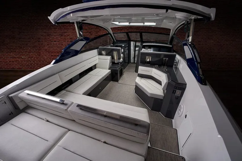 Slide: The Image of 2021 Cobalt A36BR boat interior with sleek helm and white seating. - 11