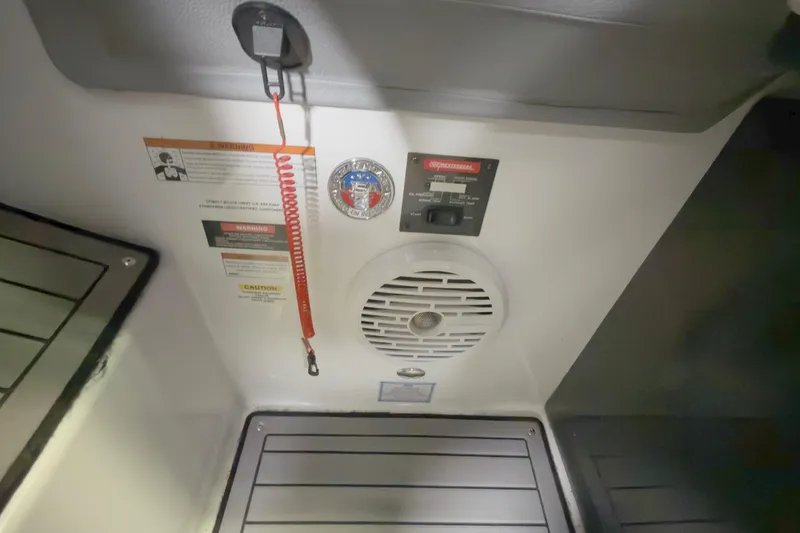 Slide: The Image of Interior of 2021 Cobalt A36BR boat showing safety features and speaker system. - 15