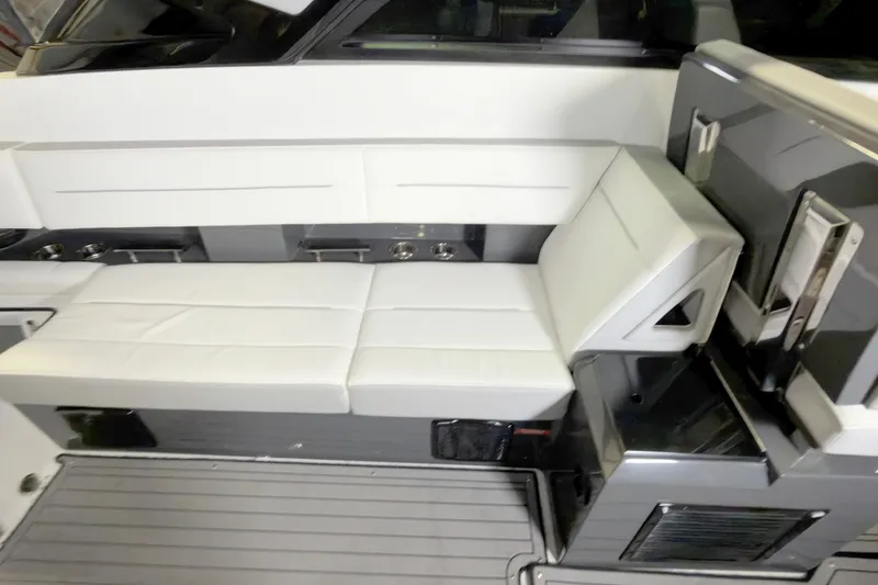 Slide: The Image of 2021 Cobalt A36BR boat interior with white seating and sleek design. - 26