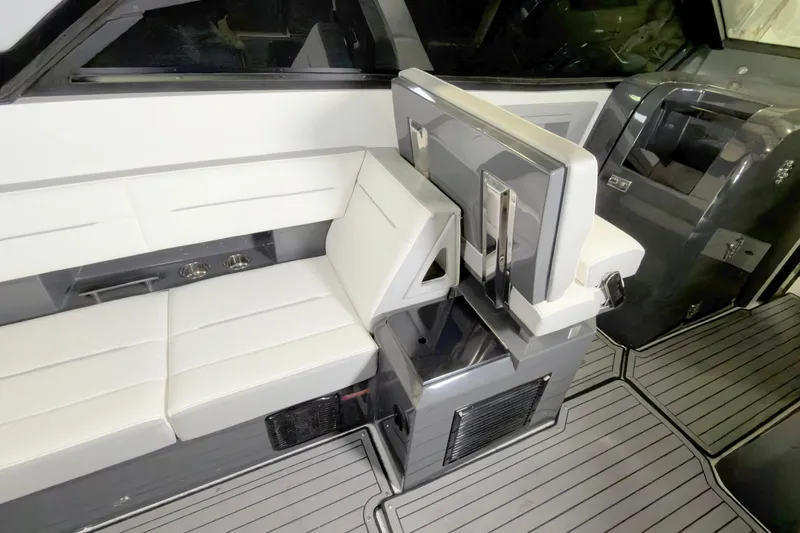 Slide: The Image of Interior of 2021 Cobalt A36BR boat with white seating and modern design. - 28