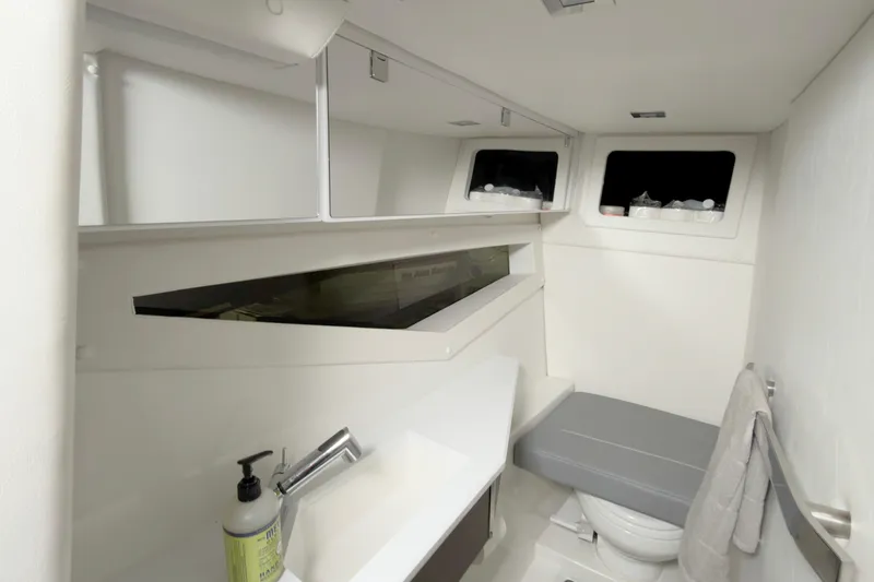 Slide: The Image of 2021 Cobalt A36BR boat bathroom interior with modern fixtures and storage. - 33