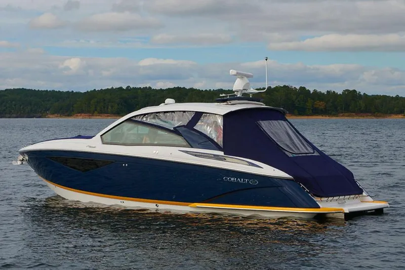 Slide: The Image of Manufacturer Provided Image: 2021 Cobalt A36BR boat interior with modern dashboard and luxurious seating. - 4