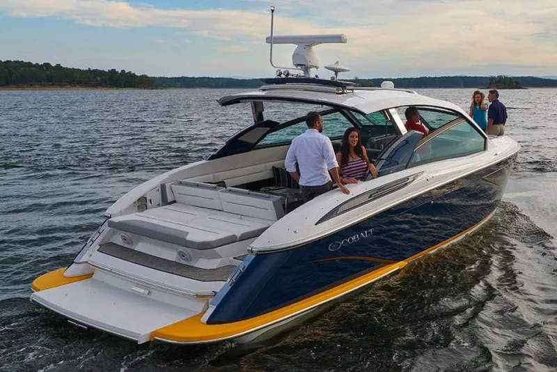 Slide: The Image of Manufacturer Provided Image: Interior of 2021 Cobalt A36BR boat with luxurious white seating and modern design. - 6