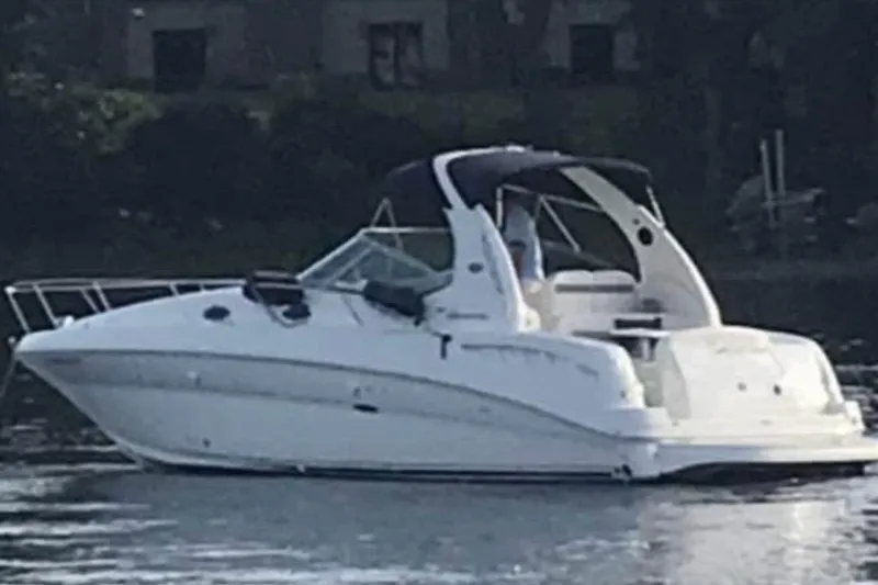 The Image of 2005 Sea Ray Sundancer 320 boat on calm water, side view. - 0