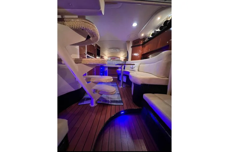 Slide: The Image of Luxurious interior of 2005 Sea Ray Sundancer 320 yacht with elegant seating and ambient lighting. - 3
