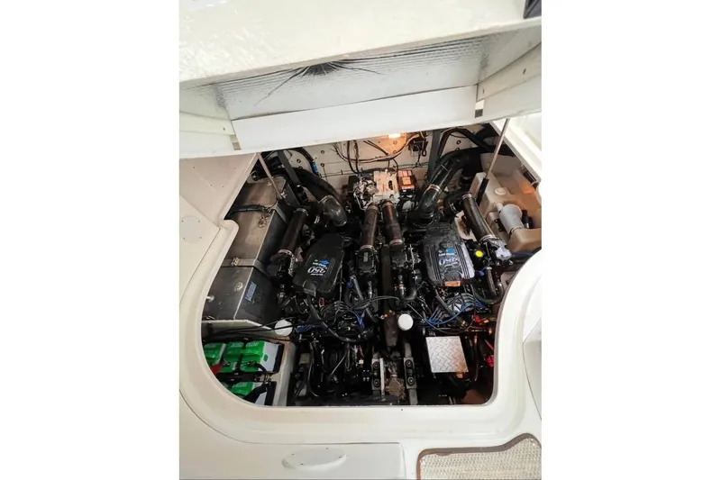 Slide: The Image of Engine compartment of a 2005 Sea Ray Sundancer 320 boat, showcasing dual engines. - 9