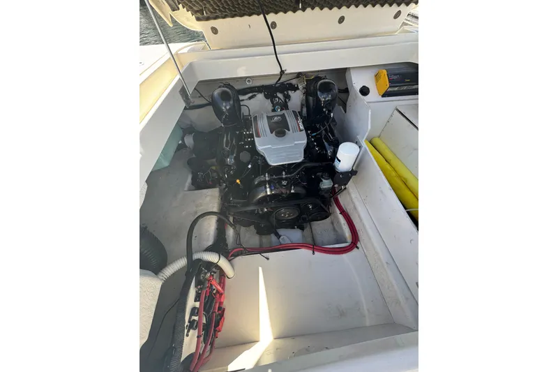 Slide: The Image of Engine compartment of a 2011 Sea Ray 260 Bow Rider boat, showcasing the engine and components. - 7
