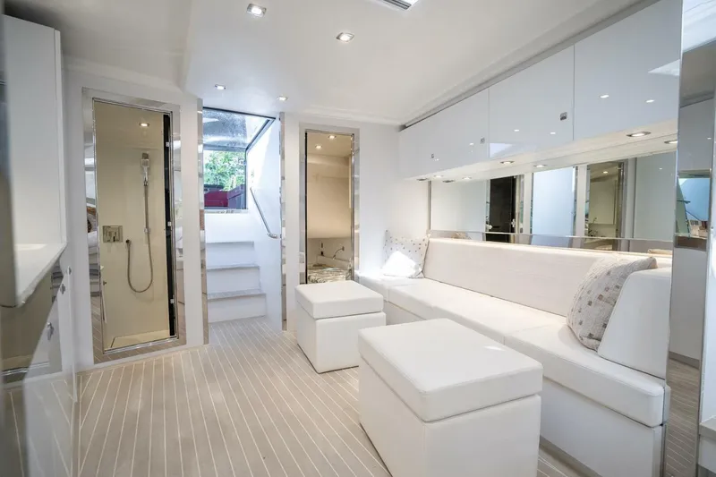 Slide: The Image of Luxurious interior of 2016 VanDutch 55 yacht with modern white furnishings and sleek design. - 16